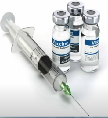 A doctor holding a syringe representing Russia’s 100% successful cancer vaccine trial results.